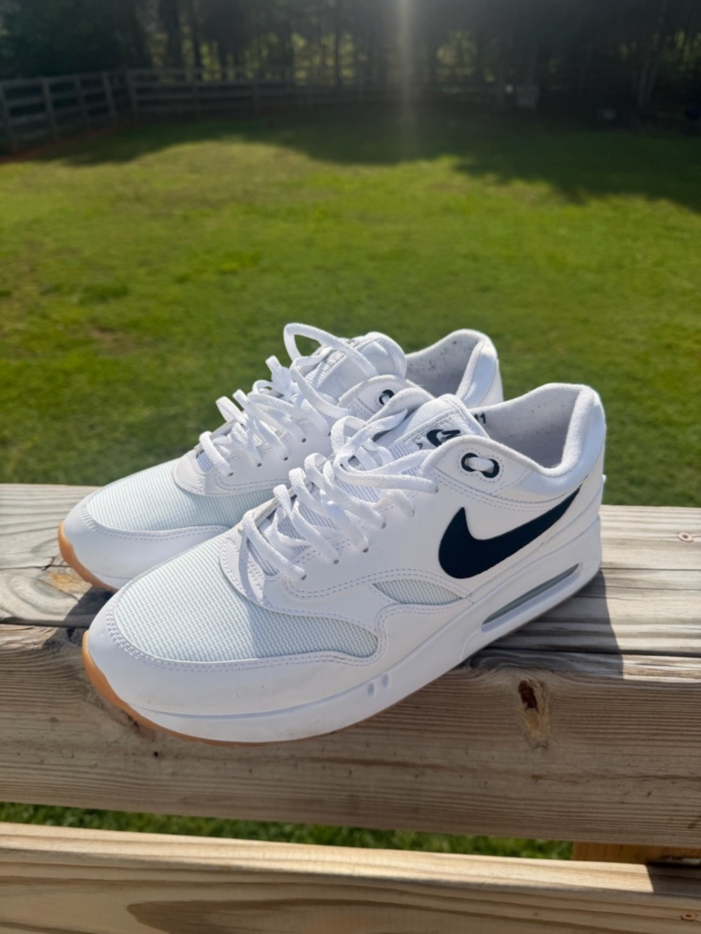 Nike White Low-Top Sneakers with Black Swoosh and Gum Outsole